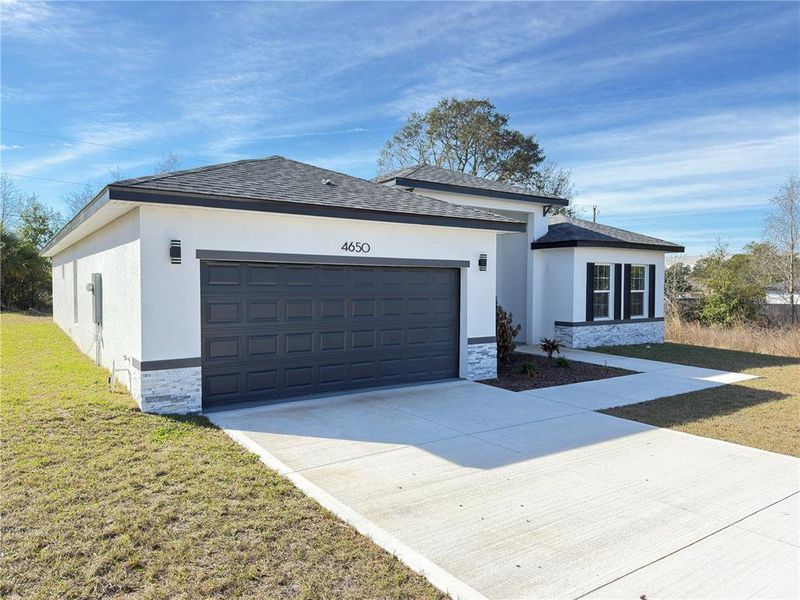 Front exterior of a new home in , Ocala, FL, highlighting curb appeal (Image 28).