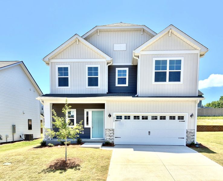 Front exterior of a new home in Holly Ridge, Greenville, SC, highlighting curb appeal (Image 1). Front exterior of a new home in Holly Ridge, Greenville, SC, highlighting curb appeal (Image 1).