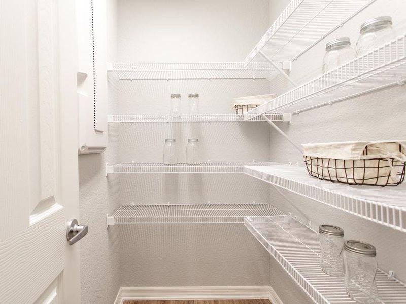 A walk-in pantry provides storage convenience - Parker by Highland Homes A walk-in pantry provides storage convenience - Parker by Highland Homes