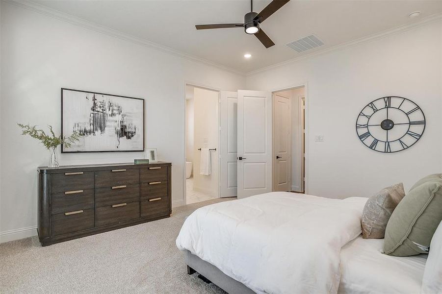 Primary Bedroom featuring ceiling fan, crown molding and large window