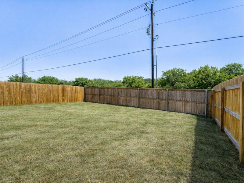 View of fenced backyard