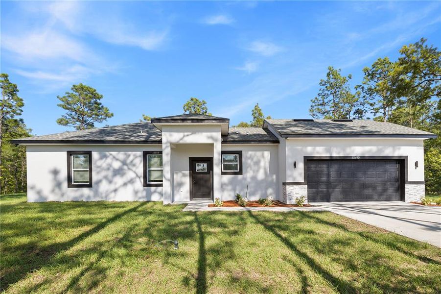 Front exterior of a new home in , Ocala, FL, highlighting curb appeal (Image 30).