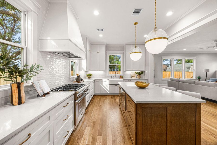 Cabinets to the ceiling, commercial grade appliances and vent hood. Farm sink over looking back yard. Cabinets to the ceiling, commercial grade appliances and vent hood. Farm sink over looking back yard.