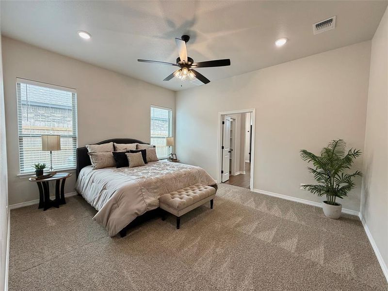 Bedroom with carpet floors, ceiling fan, and recessed lighting Bedroom with carpet floors, ceiling fan, and recessed lighting