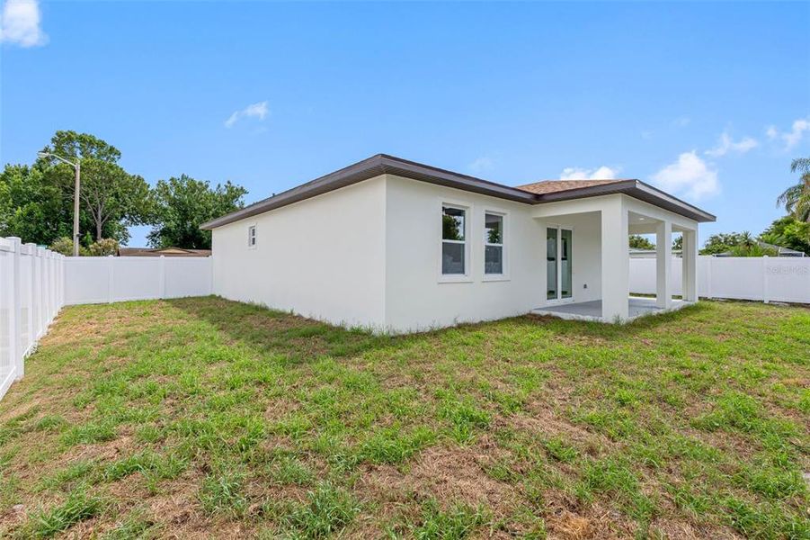 Exterior details and patio area of a home in , Port Richey (Image 4).