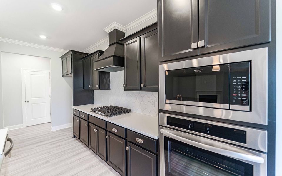 Furnished interior view inside a new home in Aden Woods, Fairview (Image 8).