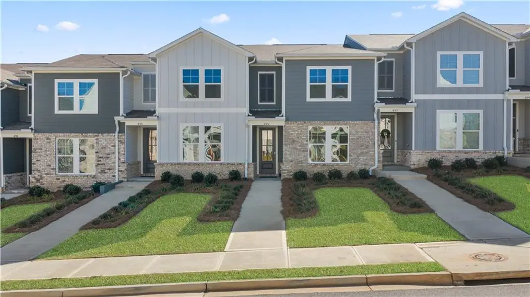 Front exterior of a new home in Stegall Village, Emerson, GA, highlighting curb appeal (Image 1). Front exterior of a new home in Stegall Village, Emerson, GA, highlighting curb appeal (Image 1).