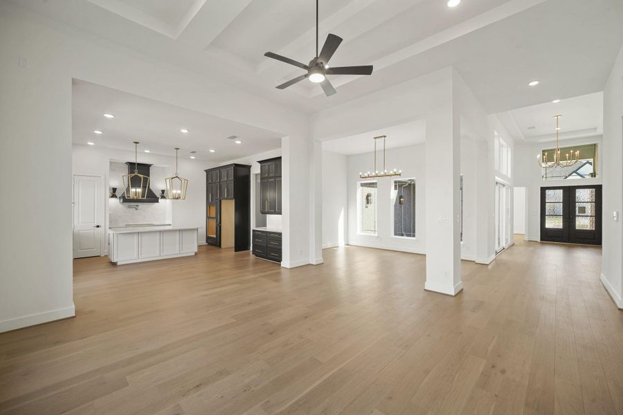 The open space features a large island at the center, with high ceilings that amplify the airy, expansive feel of the room, creating a bright and inviting atmosphere. The open space features a large island at the center, with high ceilings that amplify the airy, expansive feel of the room, creating a bright and inviting atmosphere.