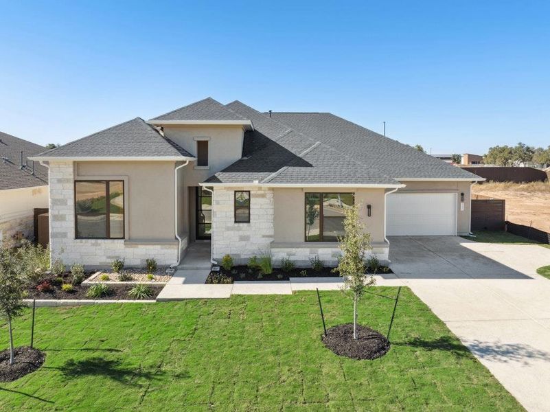 Front exterior of a new home in Riverstone, Georgetown, TX, highlighting curb appeal (Image 1). Front exterior of a new home in Riverstone, Georgetown, TX, highlighting curb appeal (Image 1).