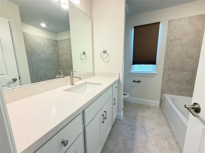 Bathroom featuring vanity and toilet Bathroom featuring vanity and toilet