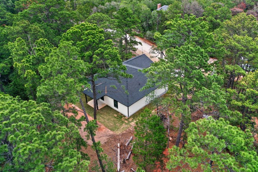 Nestled among towering pines, this secluded dwelling offers privacy and peaceful living. Nestled among towering pines, this secluded dwelling offers privacy and peaceful living.