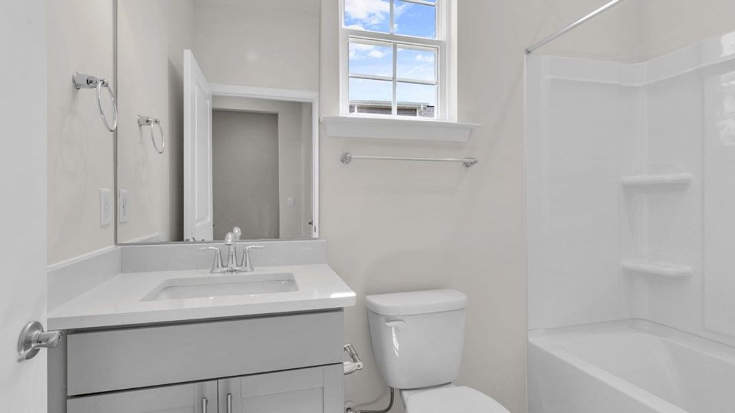 Representative furnished interior of a home built from the BRISTOL by D.R. Horton in The Villas at Galvins Ridge, Sanford (Image 5).