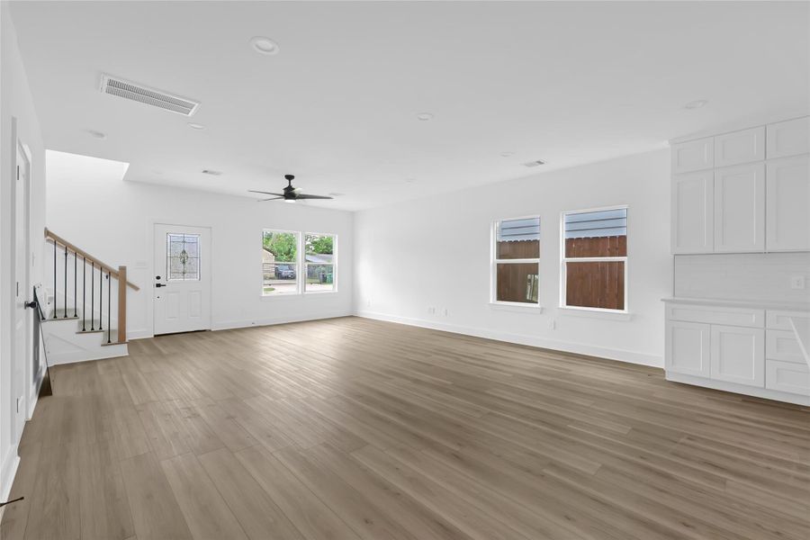 Seamless flow between kitchen, dining, and living room. Seamless flow between kitchen, dining, and living room.