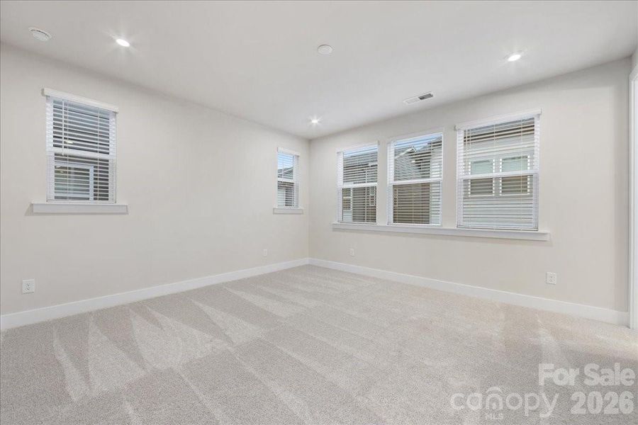 Primary Bedroom Surrounded by Windows.