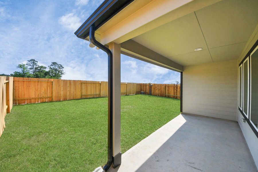 Experience outdoor living at its finest on this expansive covered patio, thoughtfully designed for BBQs and delightful outdoor dining. Sample photo of completed home with similar floor plan. Actual colors and selections may vary. Experience outdoor living at its finest on this expansive covered patio, thoughtfully designed for BBQs and delightful outdoor dining. Sample photo of completed home with similar floor plan. Actual colors and selections may vary.