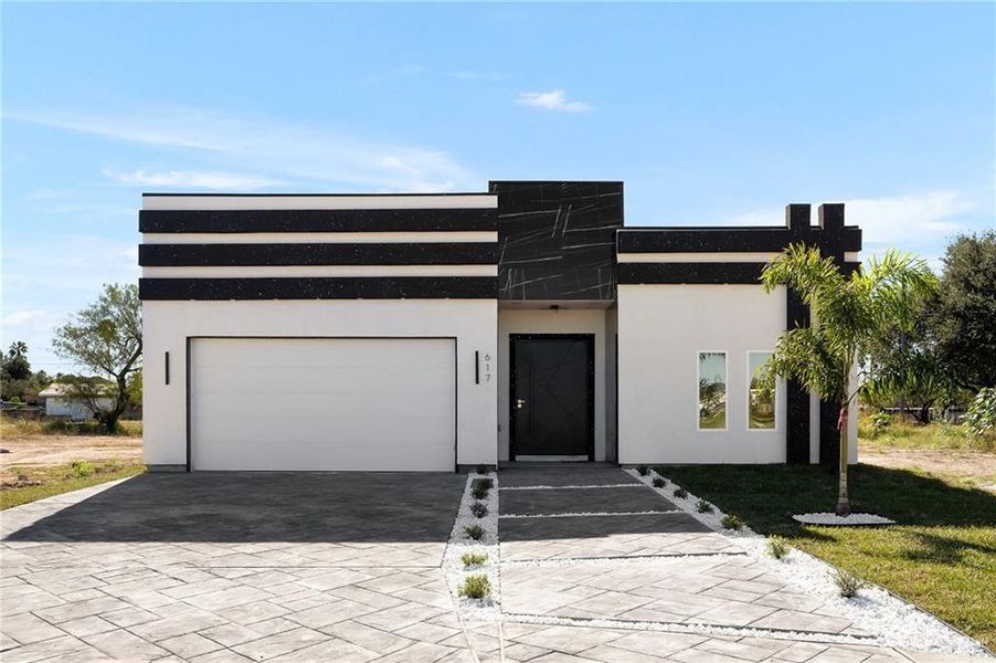 Front exterior of a new home in , Donna, TX, highlighting curb appeal (Image 1). Front exterior of a new home in , Donna, TX, highlighting curb appeal (Image 1).