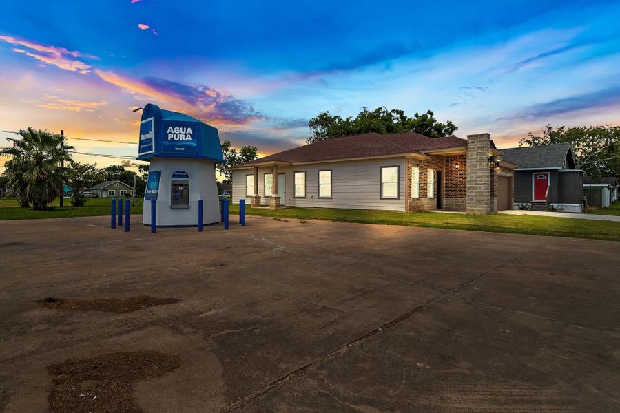 Front exterior of a new home in , Freeport, TX, highlighting curb appeal (Image 12).