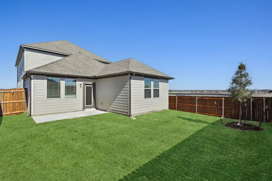 Rear view of house featuring roof with shingles Rear view of house featuring roof with shingles