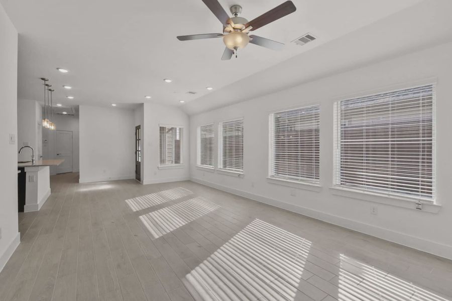 Representative unfurnished interior of a home built from the Carriagehouse by Chesmar Homes in Meridiana Townhomes, Iowa Colony (Image 89).