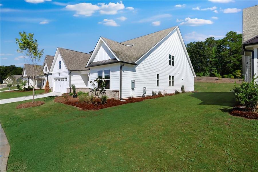 Front exterior of a new home in Twelve Parks 55+, Sharpsburg, GA, highlighting curb appeal (Image 20). Front exterior of a new home in Twelve Parks 55+, Sharpsburg, GA, highlighting curb appeal (Image 20).
