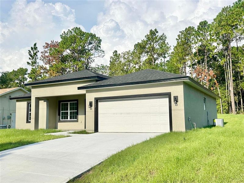 Front exterior of a new home in , Citrus Springs, FL, highlighting curb appeal (Image 18).