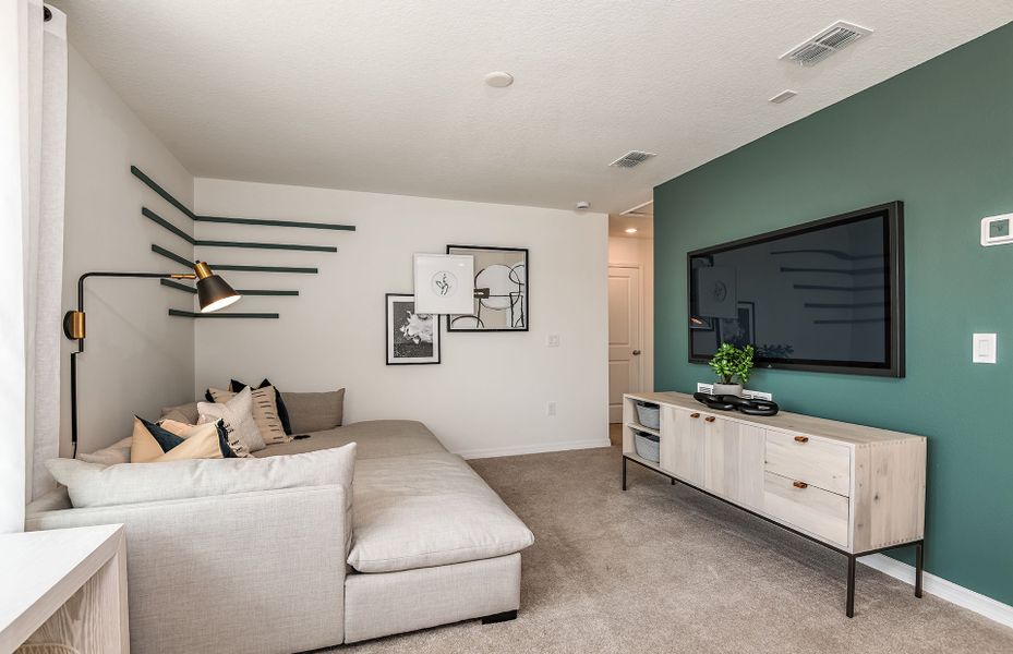 Furnished interior in a model home at Oakfield Trails in Parrish (Image 7).