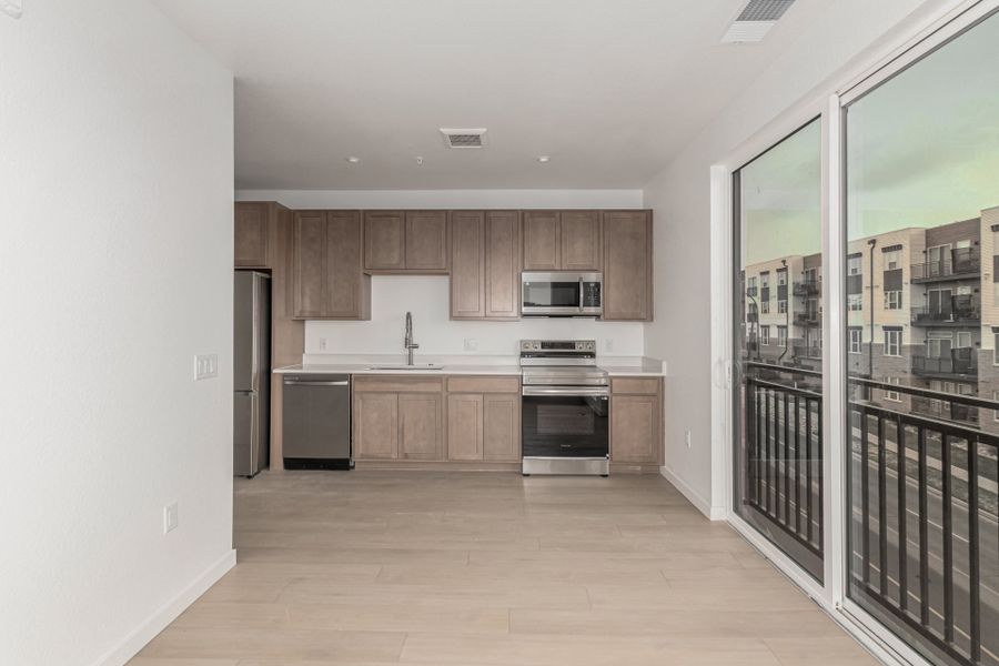 Furnished interior in a model home at The Scene at Sloan's Lake in Denver (Image 13).