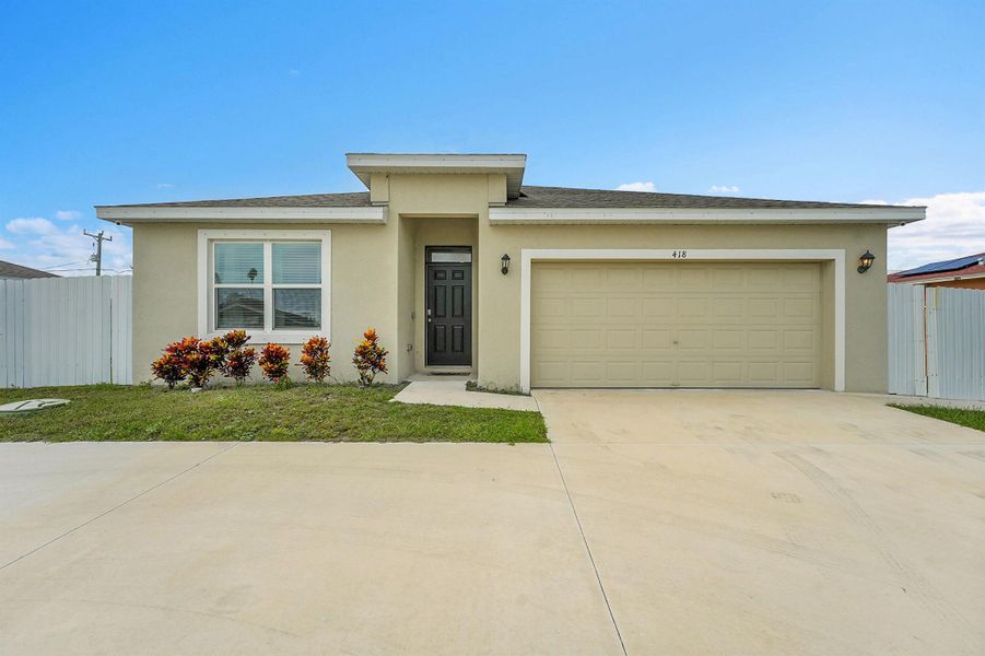 Front exterior of a new home in , Port St. Lucie, FL, highlighting curb appeal (Image 25).