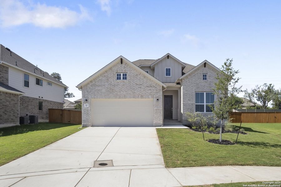 Front exterior of a new home in Foxbrook, Cibolo, TX, highlighting curb appeal (Image 1).