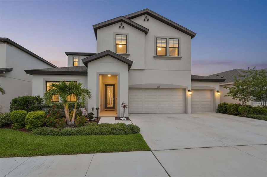 Front exterior of a new home in Waterset, Apollo Beach, FL, highlighting curb appeal (Image 1). Front exterior of a new home in Waterset, Apollo Beach, FL, highlighting curb appeal (Image 1).