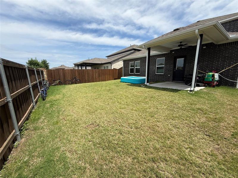 Exterior details and patio area of a home in Travis Ranch, Forney (Image 4).