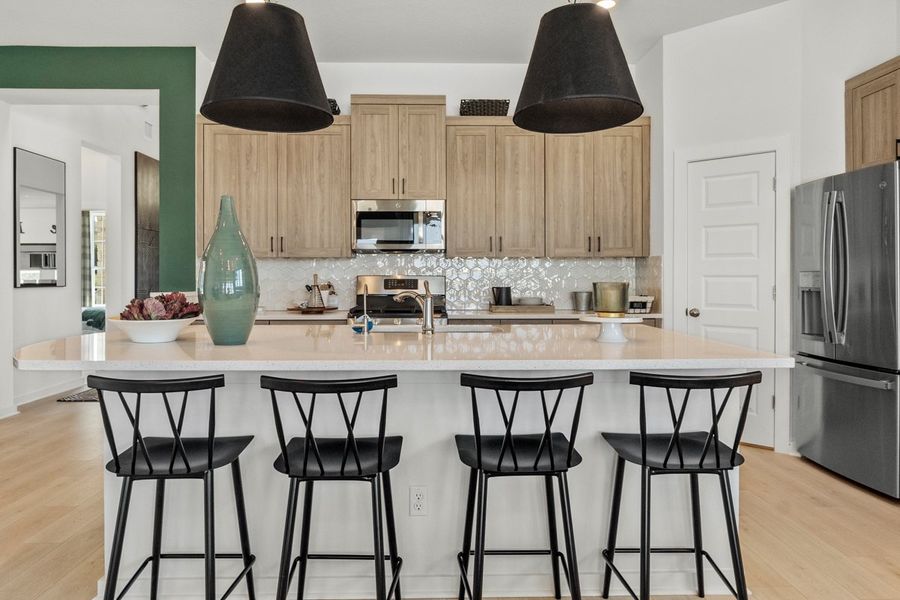 Representative furnished interior of a home built from the Peyton by Chesmar Homes in University Heights, Round Rock (Image 5).