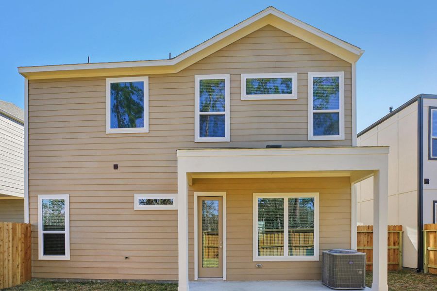 Exterior details and patio area of a home in Pinewood Trails - Luxe Series, Atascocita (Image 25).