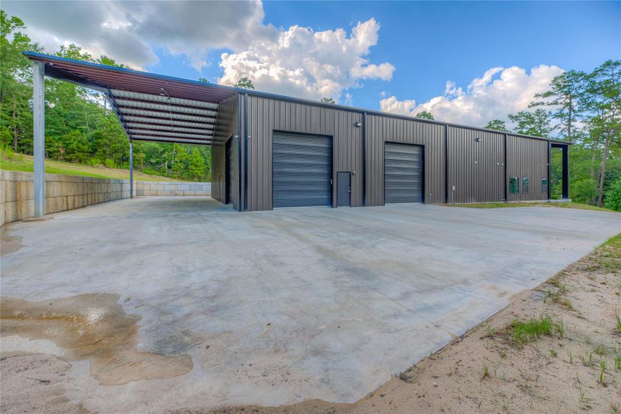 Outside of the 8,200 sqft barndominium with 3 garage doors Outside of the 8,200 sqft barndominium with 3 garage doors