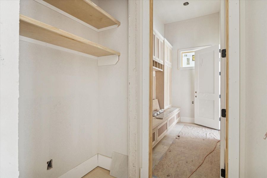 A highly functional mud room with direct access to the garage and main living area. Custom built ins provide designated storage for everyday essentials, helping keep the home organized and clutter free. This transitional space adds practicality without sacrificing the home’s overall design integrity. A highly functional mud room with direct access to the garage and main living area. Custom built ins provide designated storage for everyday essentials, helping keep the home organized and clutter free. This transitional space adds practicality without sacrificing the home’s overall design integrity.