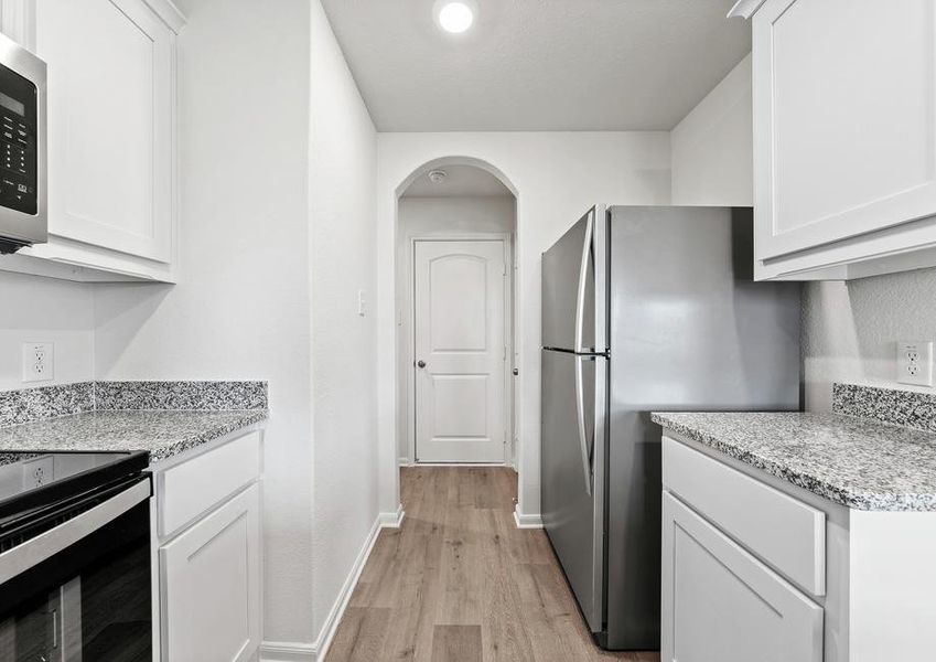 The kitchen of the Rio Grande has white wood cabinets.