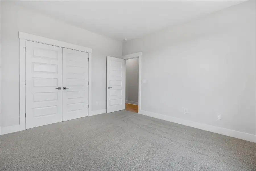 A spacious bedroom provides a blank canvas, offeri A spacious bedroom provides a blank canvas, offeri