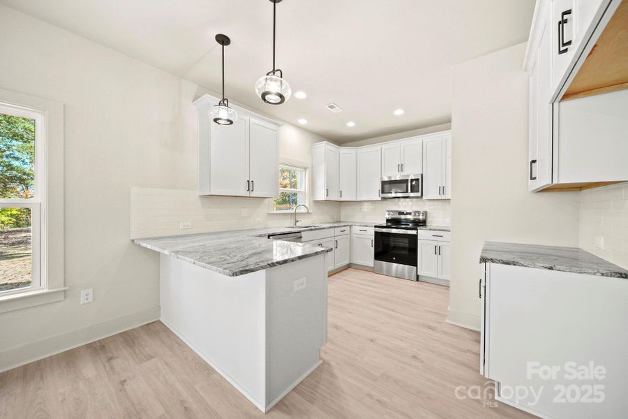Furnished interior view inside a new home in , Monroe (Image 12).