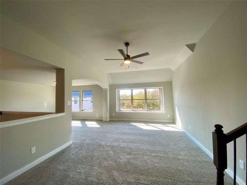 Enormous gameroom with ceiling fan is perfect as 2nd living area for kids or game tables Enormous gameroom with ceiling fan is perfect as 2nd living area for kids or game tables