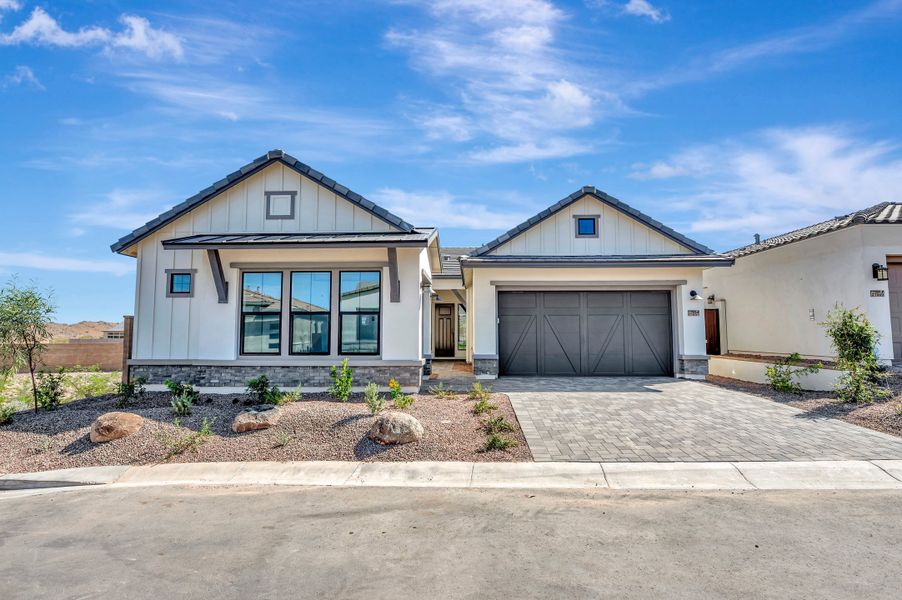 Front exterior of a new home in Skyline at Verrado Regent Hills, Buckeye, AZ, highlighting curb appeal (Image 1). Front exterior of a new home in Skyline at Verrado Regent Hills, Buckeye, AZ, highlighting curb appeal (Image 1).