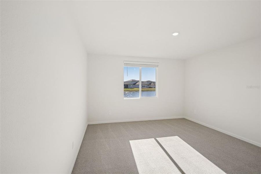 Spacious, unfurnished interior of a new home in The Grove at Stuart Crossing - Classic Series, Bartow (Image 29).