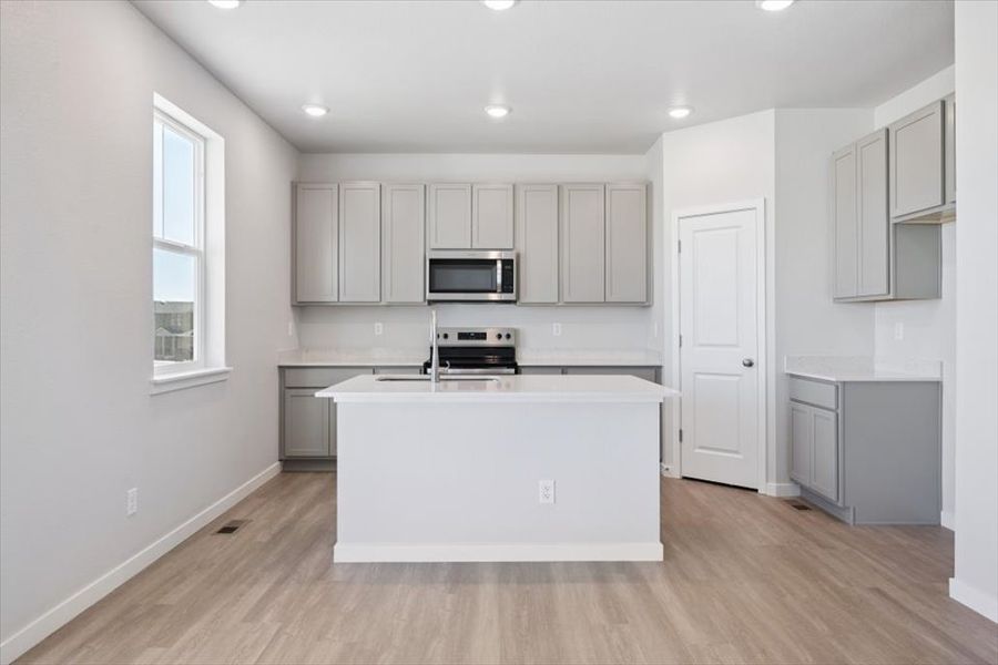A kitchen with white cabinets. A kitchen with white cabinets.