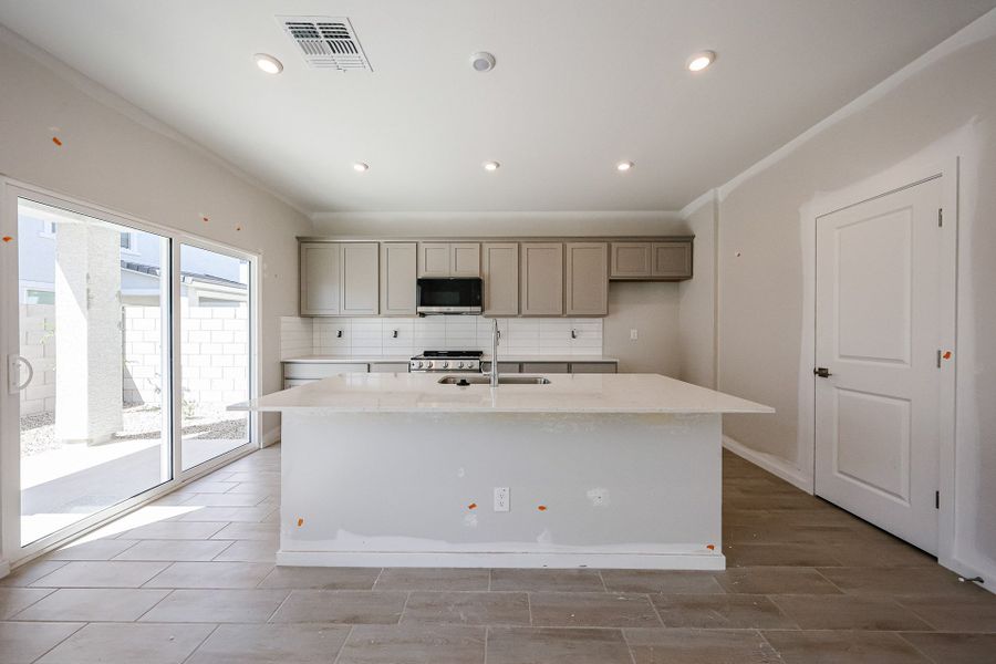 A kitchen with white cabinets. A kitchen with white cabinets.