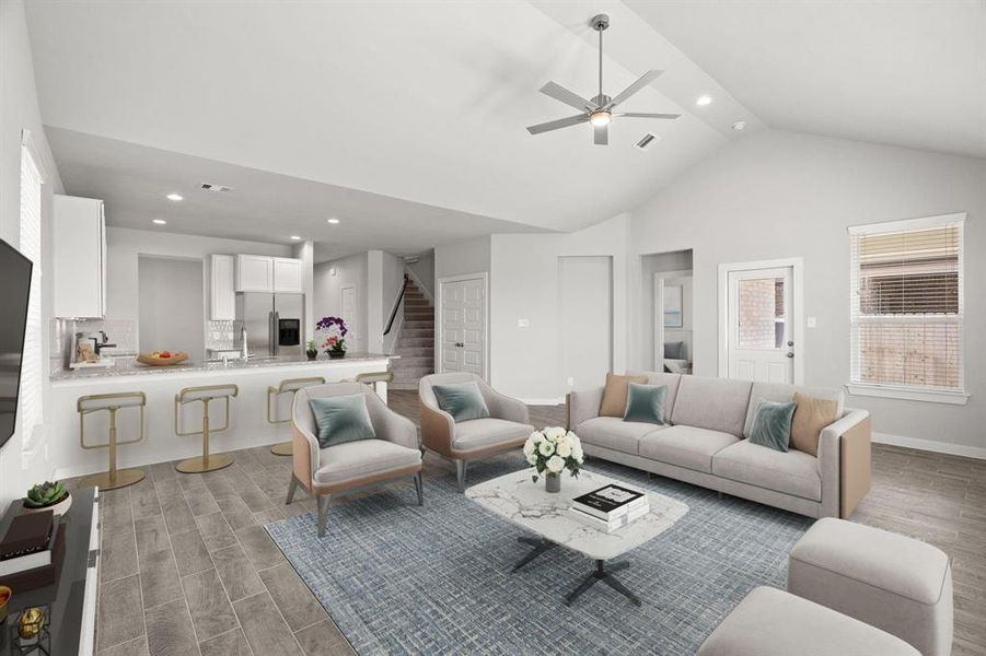 Bring your loved ones and guests together in the inviting living room! Boasting lofty high ceilings, recessed lighting, a stylish ceiling fan, custom paint, stunning flooring, and expansive windows that flood the space with ample natural light all day long.