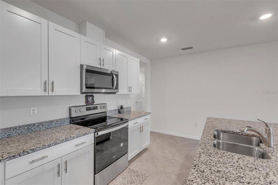 Furnished interior view inside a new home in Groveside at Ormond Station, Ormond Beach (Image 43).