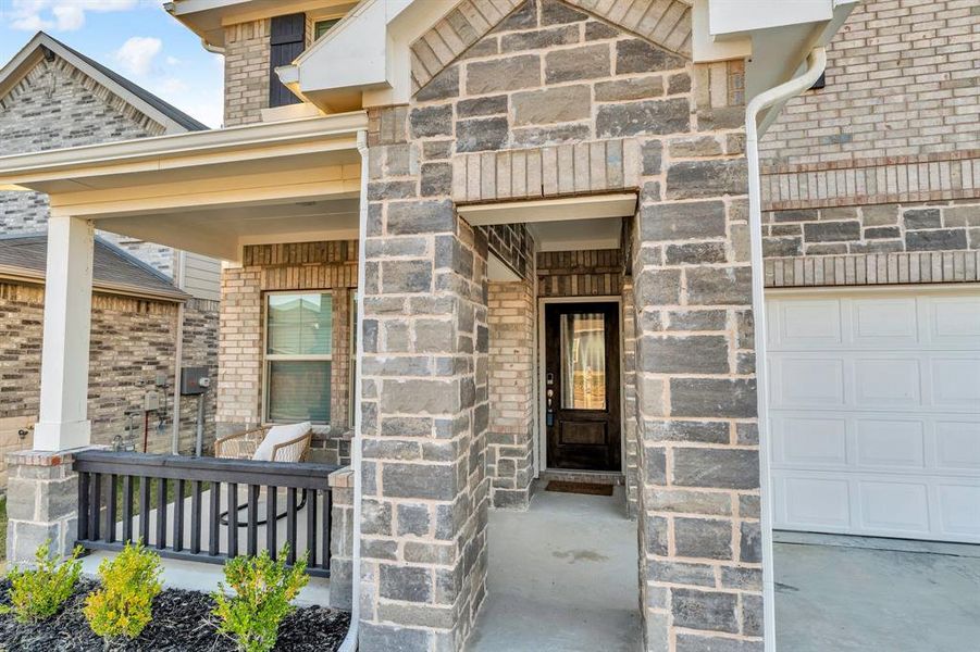 Property entrance featuring covered porch