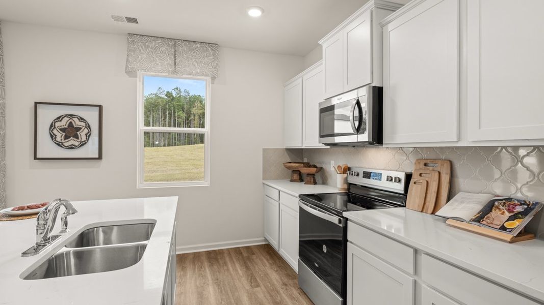 Representative furnished interior of a home built from the Hamlin by D.R. Horton in Oakchase at Hampton, Hampton (Image 6).