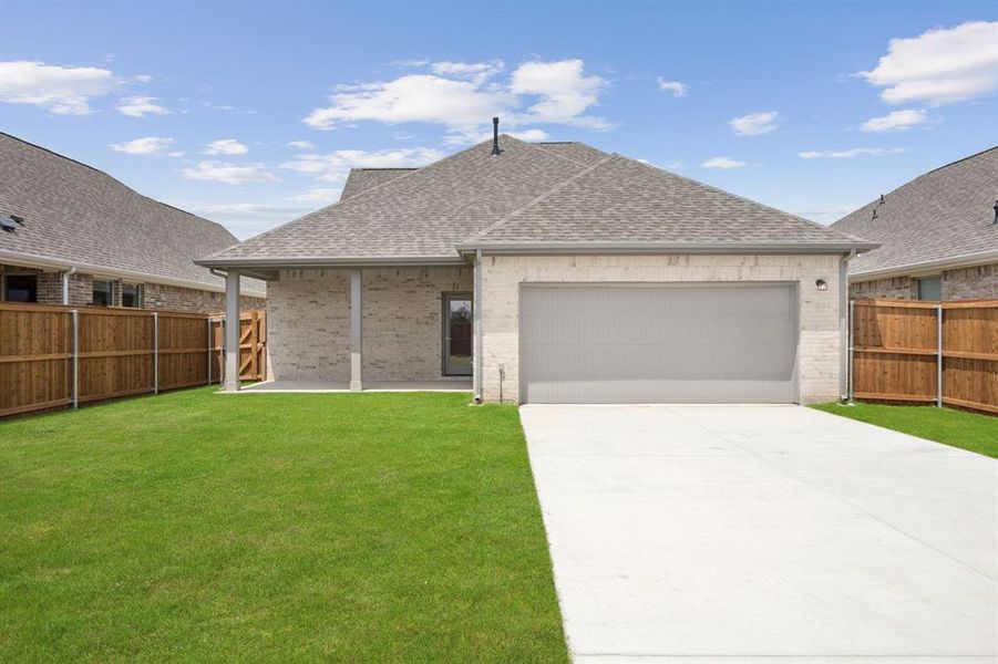 Front exterior of a new home in Dove Hollow, Waxahachie, TX, highlighting curb appeal (Image 2). Front exterior of a new home in Dove Hollow, Waxahachie, TX, highlighting curb appeal (Image 2).