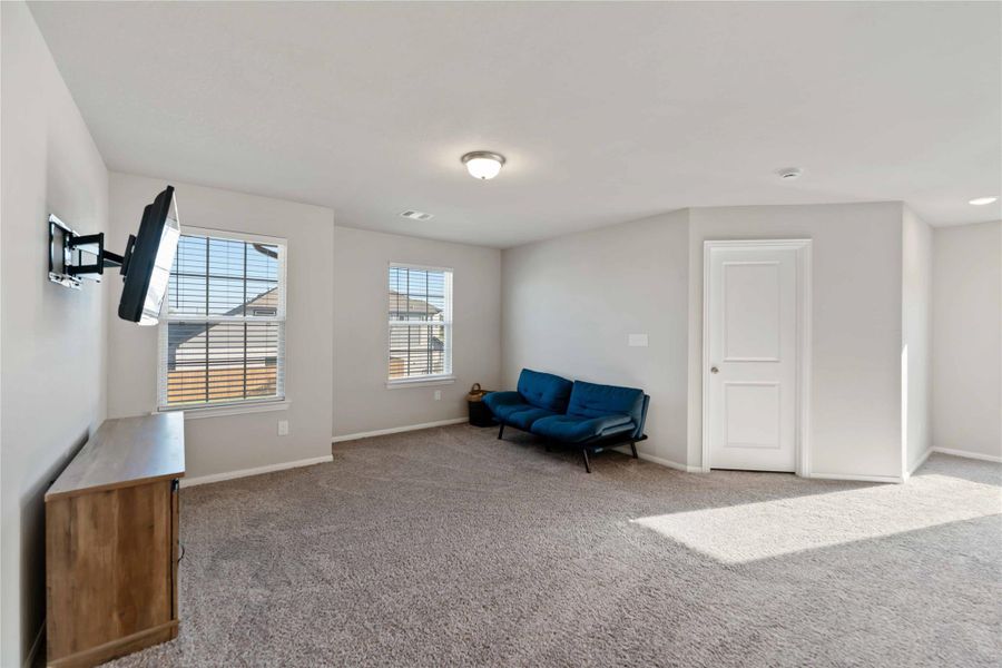 The upstairs game room offers a spacious, flexible area perfect for movie nights, a play zone, or a teen lounge. The upstairs game room offers a spacious, flexible area perfect for movie nights, a play zone, or a teen lounge.