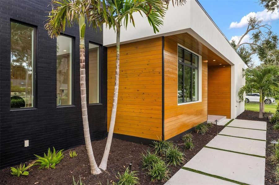 Front exterior of a new home in , Sarasota, FL, highlighting curb appeal (Image 22).